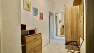 a kitchen with a dresser and a wooden cabinet at Appartement Chemnitz-Kaßberg in Chemnitz