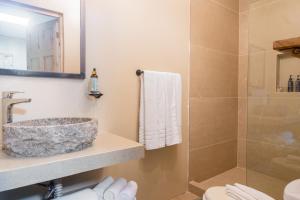 a bathroom with a sink and a shower at Marsol 2 in Bahia
