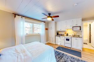 a bedroom with a bed and a ceiling fan at Sweet Retreat & Dream Weaver in Ludlow