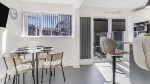 a dining room with a table and chairs at Highland House in Birmingham