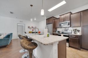 a kitchen with a large island in a room at Stay at Universal Studios - Epic Area in Orlando