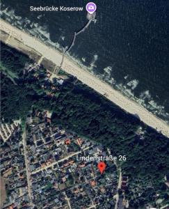 an overhead view of a parking lot next to the ocean at Haus am Meer in Koserow in Ostseebad Koserow +1 photo