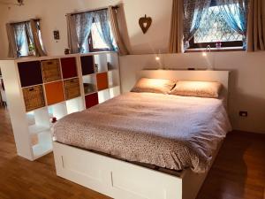 a bedroom with a bed in a room with windows at Il Nido della Buonanotte 2 KIDS friendly in Verona +41 photos