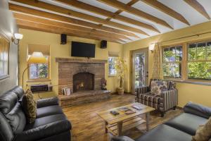 a living room with couches and a fireplace at Creekside 61 East - 2BR in Moab