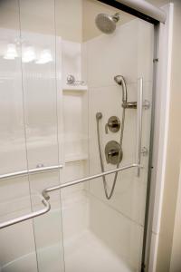 a shower stall with a glass door with a shower at The Lodge on Lamoka in Bradford +18 photos