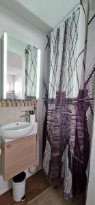 a bathroom with a sink and a mirror at Smartes Business Studio in Immensee +40 photos