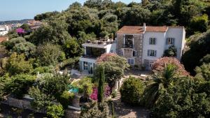 an aerial view of a house surrounded by trees at Mas Fleuri in Antibes