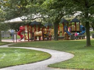 a park with a playground with a slide at Boise Blue Retreat - North End - Hot Tub - 13 St in Garden City