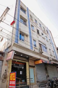 a large white building with a hotel sign on it at Hotel Siddhi Vinayak in Jodhpur +130 photos