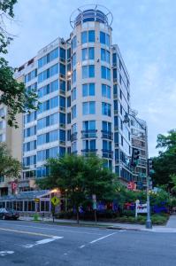 a tall white building with a circle on top of it at The Beacon at Embassy Row, WorldHotels Distinctive in Washington, D.C.