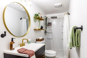 a bathroom with a sink and a mirror at Prime Location Top Rated Clean Parking Free! in Columbus