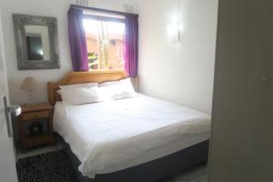 Ένα ή περισσότερα κρεβάτια σε δωμάτιο στο San Lameer Villa, Beach Estate, South Coast KZN