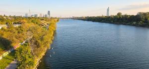 an aerial view of a river with a city in the background at Aupark Apartments in Vienna