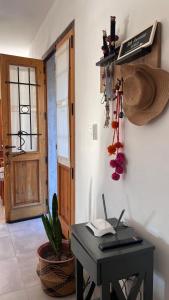 a room with a desk with a laptop on it at Sol & Río Refugio Serrano in Villa Las Rosas