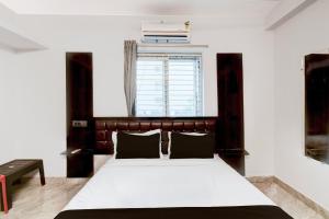 Ένα ή περισσότερα κρεβάτια σε δωμάτιο στο HOTEL O STAY INN RESIDENCY