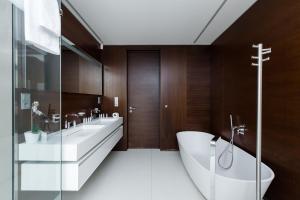 A bathroom at Grand Central Residence by TKC
