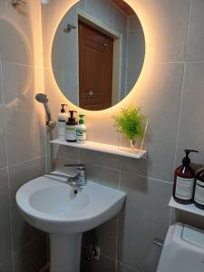 a bathroom with a sink and a mirror at 어반 팀버 수원 in Hagwanggyo-dong +51 photos