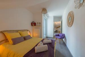 Katil atau katil-katil dalam bilik di L'Elegance - Appartement de charme aux pieds de la montagne du Taillefer