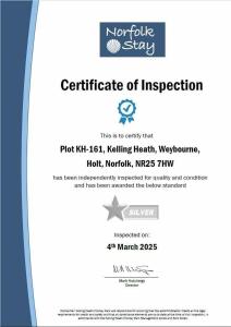 Et logo, certifikat, skilt eller en pris der bliver vist frem på Kelling Heath Holiday Park - Holiday Accommodation 20762