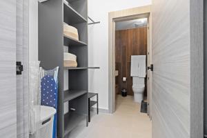 a bathroom with a toilet and a sink at NOK Perfect 1 BR by Vistacana Rentals in Punta Cana