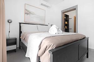 a bedroom with a large bed and a mirror at NOK Perfect 1 BR by Vistacana Rentals in Punta Cana