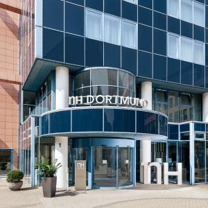 a blue building with a sign that reads midtownwind at NH Dortmund in Dortmund