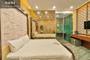 a bedroom with a large bed and a shower at S79 Hotel T68 Go Vap in Ho Chi Minh City
