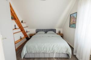 a bedroom with a bed in a attic at Rayon du Soleil in Wintzenheim