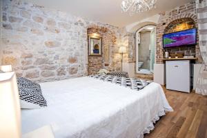 Postel nebo postele na pokoji v ubytování Carera Deluxe Rovinj