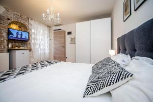Postel nebo postele na pokoji v ubytování Carera Deluxe Rovinj