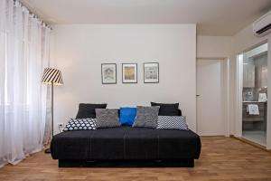 Postel nebo postele na pokoji v ubytování Carera Deluxe Rovinj