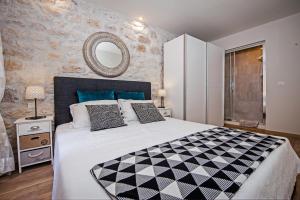 Postel nebo postele na pokoji v ubytování Carera Deluxe Rovinj