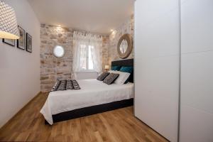 Postel nebo postele na pokoji v ubytování Carera Deluxe Rovinj