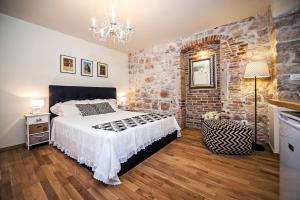 Postel nebo postele na pokoji v ubytování Carera Deluxe Rovinj