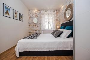 Postel nebo postele na pokoji v ubytování Carera Deluxe Rovinj