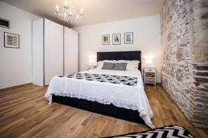 Postel nebo postele na pokoji v ubytování Carera Deluxe Rovinj