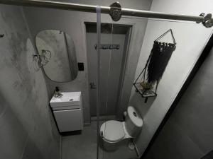 a bathroom with a shower and a toilet and a sink at Espectacular apartaestudio en envigado cerca de todo in Envigado