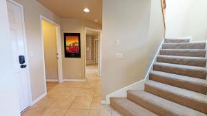 a hallway with stairs in a home at River Ridge 423AB condo in Bend