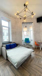 Postel nebo postele na pokoji v ubytování Квартира-студія в центрі міста біля Ратуші