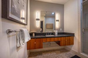 a bathroom with a sink and a mirror at Doppio Perch condo in Hood River