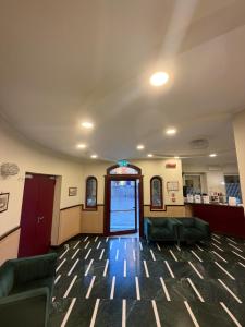 an empty waiting room with couches and a lobby at Palazzo Sant'Antonio in Rome