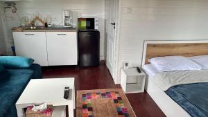 Ένα ή περισσότερα κρεβάτια σε δωμάτιο στο Mika Tiny House