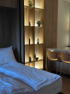 a bedroom with a bed and a table with chairs at Vucko A 07 in Jahorina