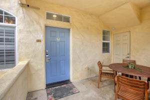 a blue door in a room with a table at Pacific Plaza #304 - Condo on the Coastline - 1BdrmD-K-QSofa in Oceano