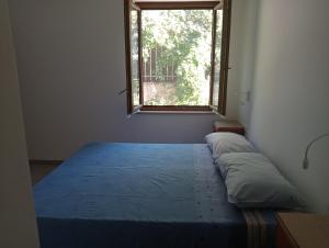 Ένα ή περισσότερα κρεβάτια σε δωμάτιο στο Aeroporto Ciampino Bici Grill Decimo Miglio