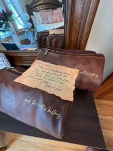 a suitcase sitting on a table in a bedroom at The Rest Is History in Baraboo