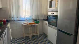 a kitchen with a blue and white tiled floor at Luar de Prata by Portus Alacer in Crato +23 photos
