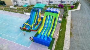 an overhead view of a inflatable water slide on a court at El Paraíso Eco Resort in Pisco