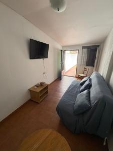 a bedroom with a bed and a flat screen tv at Nobleza Nava del Rey in Nava del Rey