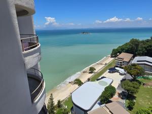 a view of the ocean from a building at Rainbow Paradise by RF Home Management in Tanjung Bungah